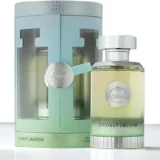 Estuche cilíndrico turquesa y verde de Coconut Lagoon 100 ml de Paris Corner con ventana troquelada, junto al frasco con emblema plateado