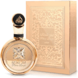Botella de perfume elegante con diseño dorado y caja decorativa, ideal para regalo o uso personal.