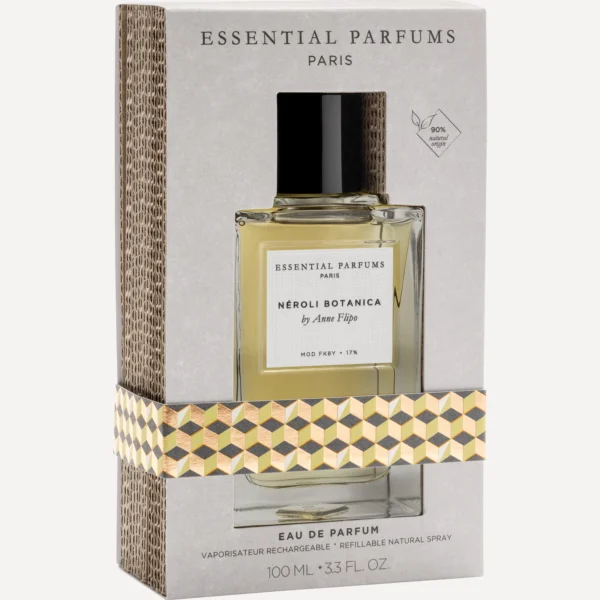 Estuche gris de Néroli Botanica 100 ml de Essential Parfums en tres cuartos, con ventana troquelada, faja geométrica dorada y lomo de cartón ondulado
