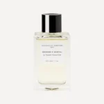 Frasco de Essential Parfums Orange X Santal 100 ml sobre fondo crema.