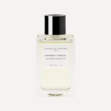 Frasco de Essential Parfums Orange X Santal 100 ml sobre fondo crema.